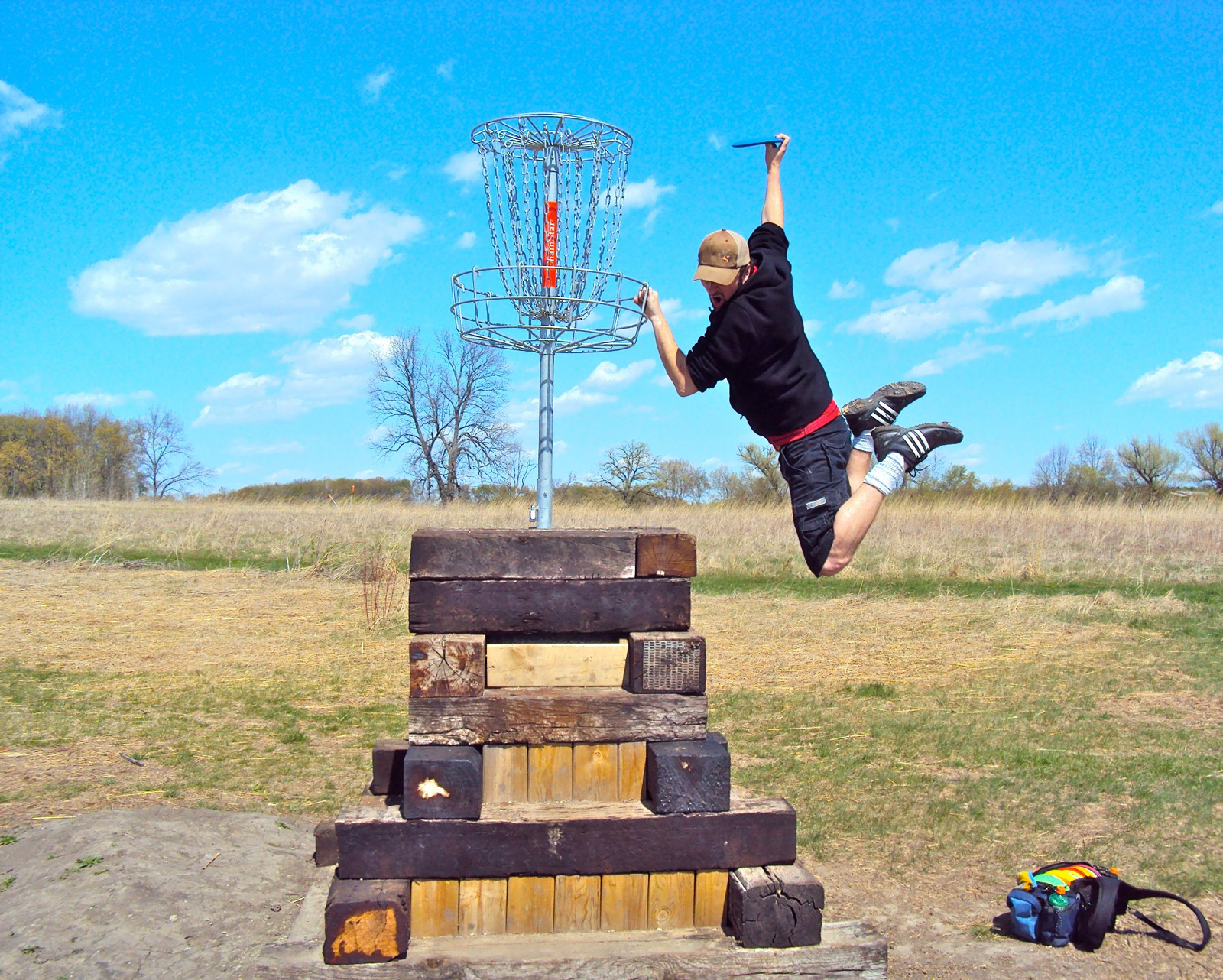 Slam dunking a disc in the basket!